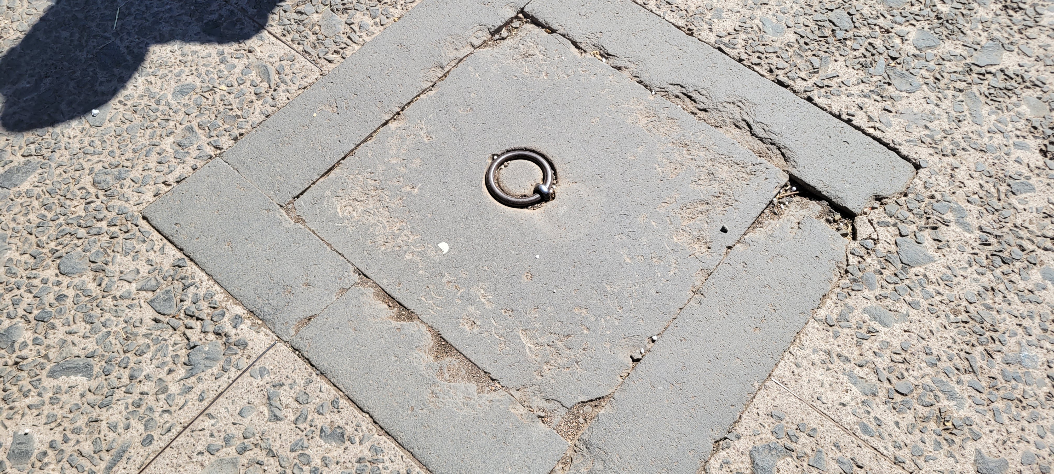 Sewer or drain access from a road in the forum